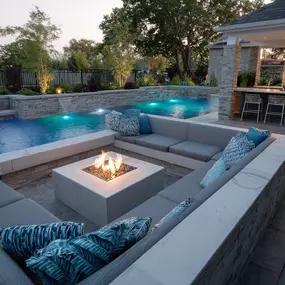 Get Inspired! Resort-Style Living with a pool, fire pit with lounge seating and outdoor kitchen. Lets begin your Houston area backyard upgrade journey today!