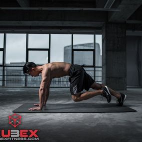 male working out on an exercise mat