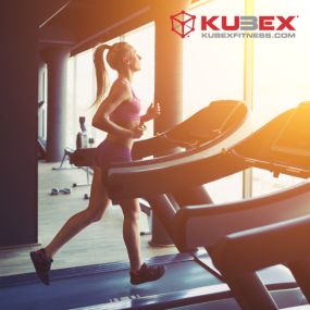 female running on a treadmill at Kubex Fitness in logan utah