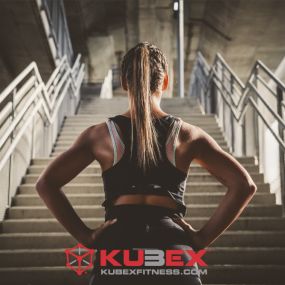 woman staring at a flight of stairs