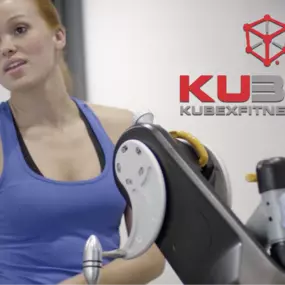 Woman working out at Kubex Fitness