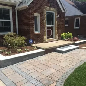 House with hardscaping built by M & D Design & Build