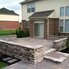 House with hardscaping built by M & D Design & Build