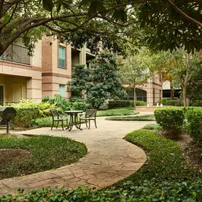 Scenic Courtyards with Green Space and Grills at Camden Greenway Apartments in Houston, TX