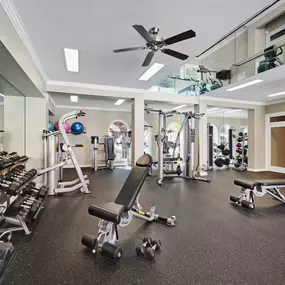 Two-story fitness center with free weights and cardio equipment at Camden Greenway Apartments in Houston, TX