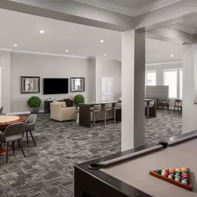 Resident game lounge with poker tables and billiards at Camden Greenway Apartments in Houston, TX