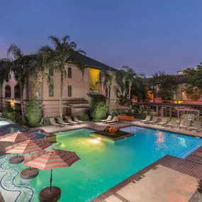 Resort-Style Swimming pool at Dusk at Camden Greenway Apartments in Houston, TX