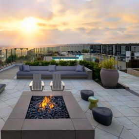 Camden Hillcrest Apartments San Diego CA Outdoor seating area near firepit with sunset view