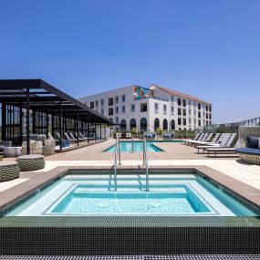 Camden Hillcrest apartments in San Diego CA infinity edge spa and pool with cabanas and day bed loungers and sun deck