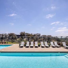 Camden Hillcrest Apartments San Diego CA Expansive pool and sun deck with loungers overlooking canyon views to the ocean