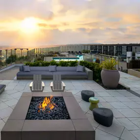 Camden Hillcrest Apartments San Diego CA Outdoor seating area near firepit with sunset view