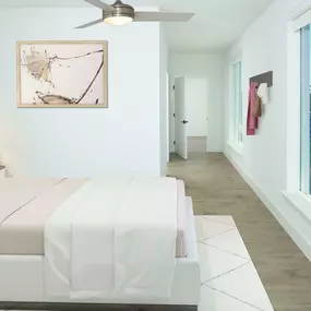 Main bedroom with seven-and-a-half-inch white oak hardwood flooring, multiple windows, and a ceiling fan