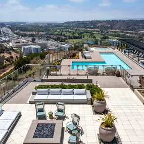 Camden Hillcrest apartments in San Diego CA aerial view of lounge area with fire pit and pool with cabanas and infinity edge spa with ocean views