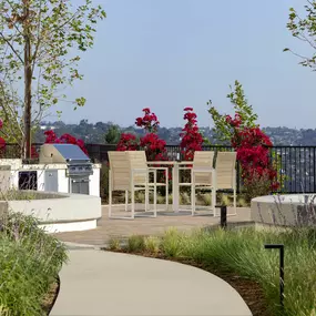 Exclusive barbecue grilling station with sink and dining areas