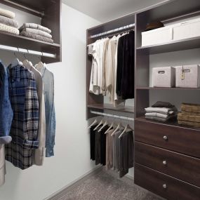 Closet with carpet and built-in shelves and drawers at Camden Belmont apartments in Dallas, Tx