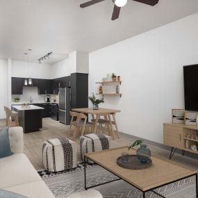 Modern style living room and kitchen with wood-style floors throughout at Camden Belmont apartments in Dallas, Tx