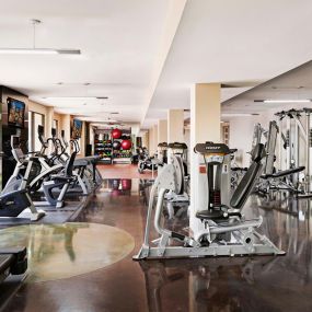 24 hour fitness center with cardio and strength training equipment