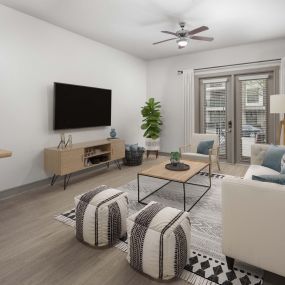 Modern-style living room with wood-style floors at Camden Belmont apartments in Dallas, Tx