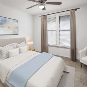 Bedroom with ceiling fan and carpet flooring