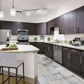 Contemporary style kitchen with island and tile flooring