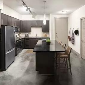 Urban style kitchen with black granite countertops and cement flooring