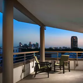 Corner balcony with downtown dallas view at night