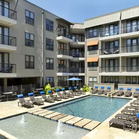 Pool and sundeck with plenty of seating at Camden Belmont apartments in Dallas, TX