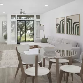 Townhome open dining and living with wood-style flooring and park-view private balcony on the main floor at Camden Belmont apartments in Dallas, TX