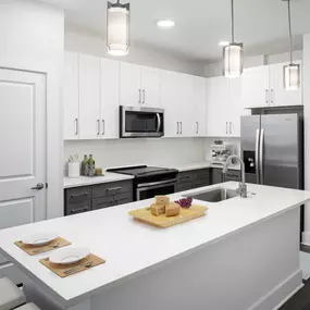 Desert modern style kitchen island with barstool seating and pantry and stainless steel appliances