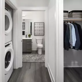 Desert modern style full size stacked washer and dryer and walk in closet