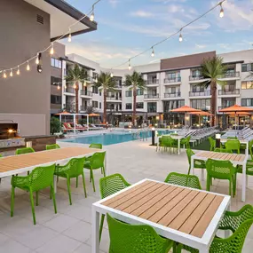 Barbecue grilling stations with dining areas near the pool