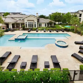 Resort style pool with lounge chairs