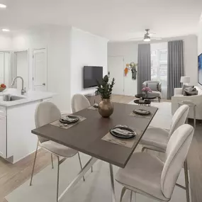 Open-concept living, kitchen, and dining area in apartment home at Camden Grand Harbor in Katy, TX