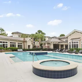 Resort style pool with water feature at Camden Grand Harbor Apartments in Katy, Tx