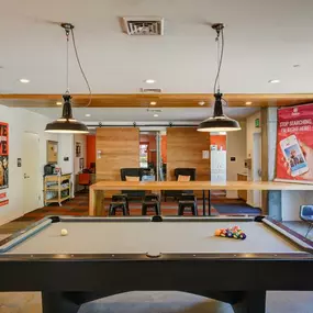 Resident lounge, including a pool table and ping pong table.