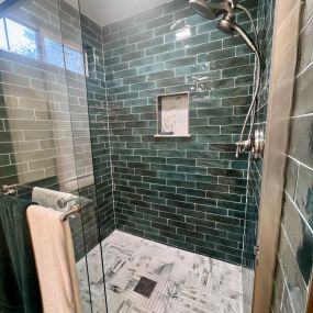 Stunning new shower unit is beautifully tiled with subway tiles.