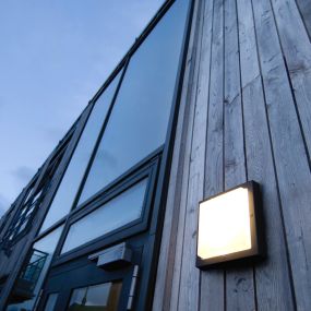 We love Nordic simplicity as inspiration for exterior siding and lighting.