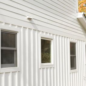 Fiber cement vertical siding is contemporary and modern.