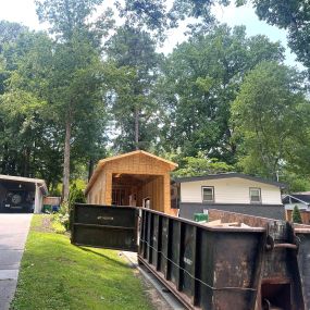 Garage room addition in Atlanta with haul away dumpster