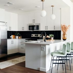 Kitchen remodel with sage green bar stools