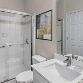 Bathroom with stand-up shower with glass door at Camden Governors Village Apartments in Chapel Hill, NC
