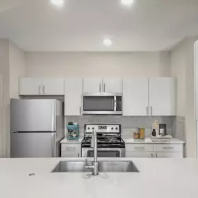 Kitchen with quartz countertops at Camden Governors Village Apartments in Chapel Hill, NC