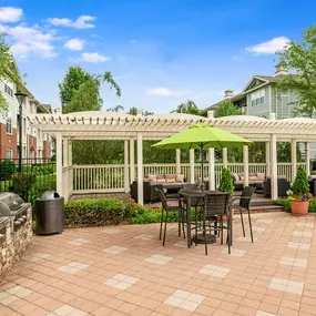 Outdoor dining and barbeque area at Camden Governors Village Apartments in Chapel Hill, NC