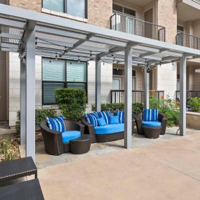 Pool deck cabanas with seating at Camden Lamar Heights