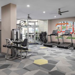 24-hour fitness center with Austin mural at Camden Lamar Heights apartments in Austin, TX