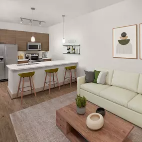 Open-concept living room with wood-style flooring at Camden Lamar Heights