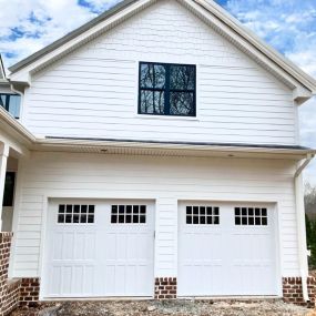 White home with double garage doors