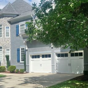 large house with white garage doors