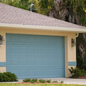 house with new blue garage door