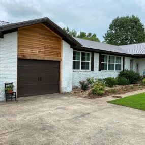 home with a black garage door